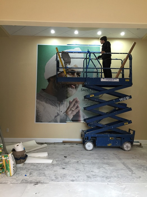 How are wall murals installed