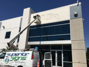 Building Sign Removals with our Aerial Bucket Van